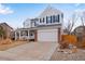 Two-story home with a two-car garage, front porch, and neutral exterior at 2918 W 135Th Pl, Thornton, CO 80241