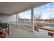 Covered front porch with white columns, a seating area, and view of the neighborhood at 2918 W 135Th Pl, Thornton, CO 80241