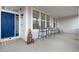 Inviting front porch with a seating area, a blue front door, and decor at 2918 W 135Th Pl, Thornton, CO 80241