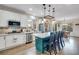Spacious kitchen with stainless steel appliances and a large kitchen island with seating at 2918 W 135Th Pl, Thornton, CO 80241