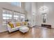 Bright living room with hardwood floors, high ceilings, and a large window at 2918 W 135Th Pl, Thornton, CO 80241