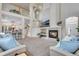 Spacious living room with a fireplace, soaring ceilings, and an open layout, perfect for entertaining at 2918 W 135Th Pl, Thornton, CO 80241