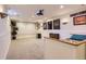 Spacious basement media room with sports memorabilia and home theater setup at 6212 S Ash W Cir, Centennial, CO 80121