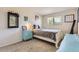 Bright bedroom with a white bed frame and light blue dresser with décor at 6212 S Ash W Cir, Centennial, CO 80121