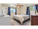 Bright bedroom with ample natural light, comfortable bed, and stylish curtains at 6212 S Ash W Cir, Centennial, CO 80121
