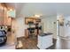Functional kitchen features wood cabinets, stainless steel appliances, and a stylish central island at 6212 S Ash W Cir, Centennial, CO 80121