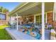 Covered patio featuring a colorful rug, an outdoor dining set, and a grill at 6212 S Ash W Cir, Centennial, CO 80121