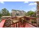 Outdoor deck space with wood furnishings and views of the surrounding neighborhood at 22062 E Irish Dr, Aurora, CO 80016