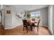 Cozy dining area with hardwood floors, natural light, and views to the kitchen at 22062 E Irish Dr, Aurora, CO 80016