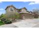 Inviting two-story townhouse with stone accents, attached garage, and well-maintained landscaping at 22062 E Irish Dr, Aurora, CO 80016