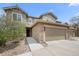 Beautiful townhouse with stone accents, attached garage, and a welcoming front entrance at 22062 E Irish Dr, Aurora, CO 80016