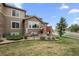 Beautiful two-story home featuring a deck, stone accents and a well-maintained lawn at 22062 E Irish Dr, Aurora, CO 80016