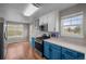 Kitchen view featuring stainless steel oven and cooktop, blue cabinets, and eat in kitchen area at 22062 E Irish Dr, Aurora, CO 80016