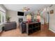 Warm living area with hardwood floors, fireplace, and staircase access at 22062 E Irish Dr, Aurora, CO 80016