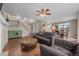 Spacious living room with wood floors, staircase, and dining area at 22062 E Irish Dr, Aurora, CO 80016