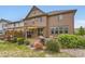 Serene backyard with a patio, green lawn, and attractive landscaping at 2165 Summerlin Ln, Longmont, CO 80503