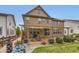 Beautiful backyard featuring a patio, lush lawn, and mature landscaping at 2165 Summerlin Ln, Longmont, CO 80503