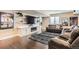 Finished basement featuring a cozy entertainment area with a fireplace and comfortable seating at 2165 Summerlin Ln, Longmont, CO 80503