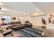 Spacious finished basement with dark hardwood floors, comfortable seating, and open layout at 2165 Summerlin Ln, Longmont, CO 80503