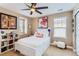 Bedroom featuring lots of natural light, fun decor, and white furniture at 2165 Summerlin Ln, Longmont, CO 80503