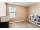 Bedroom with a large window, neutral walls, and a cubby shelf at 2165 Summerlin Ln, Longmont, CO 80503