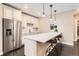 Modern kitchen with stainless steel appliances, sleek countertops, and pendant lighting at 2165 Summerlin Ln, Longmont, CO 80503