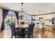 Bright kitchen features a large island with seating, quartz countertops, and stainless steel appliances at 2165 Summerlin Ln, Longmont, CO 80503