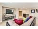 Relaxing living room space with modern furnishings and mounted television over built-in storage at 2165 Summerlin Ln, Longmont, CO 80503