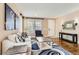 Cozy living room with comfortable seating, hardwood floors, and plenty of natural light at 2165 Summerlin Ln, Longmont, CO 80503