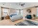 Spacious main bedroom with ceiling fan, natural light, and comfortable, light blue accents at 2165 Summerlin Ln, Longmont, CO 80503