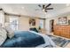 Spacious main bedroom with ceiling fan, natural light, and en-suite bathroom with walk-in closet at 2165 Summerlin Ln, Longmont, CO 80503