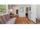 Bedroom featuring hardwood floors, futon, and a view into the home's hallway at 5445 Reed Ct, Arvada, CO 80002