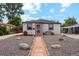 Charming single-story home featuring a well-maintained front yard and decorative rock landscaping at 5445 Reed Ct, Arvada, CO 80002