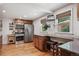 Well-equipped kitchen with stainless steel appliances, granite countertops, and a cozy breakfast bar at 5445 Reed Ct, Arvada, CO 80002