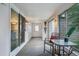 Enclosed sun room with slider doors to the backyard offers a bonus space at 5445 Reed Ct, Arvada, CO 80002