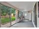 Bright sun room with a table and chairs and views of the backyard at 5445 Reed Ct, Arvada, CO 80002