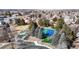 Aerial view of park area, tennis courts and playground in a well-kept neighborhood at 2266 S Kenton St, Aurora, CO 80014