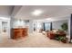 Spacious finished basement featuring a bar area, neutral carpet, and ample seating at 2266 S Kenton St, Aurora, CO 80014