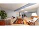 Large basement living area with carpet, two sofas, and a rocking chair at 2266 S Kenton St, Aurora, CO 80014