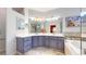 Bathroom featuring a dual sink vanity with cabinets and a corner soaking tub at 2266 S Kenton St, Aurora, CO 80014