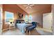 Inviting bedroom features a ceiling fan, plush carpeting, and natural light from the windows at 2266 S Kenton St, Aurora, CO 80014
