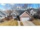 Front exterior of a brick and siding house with a lawn and driveway at 2266 S Kenton St, Aurora, CO 80014