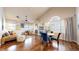 Comfortable living and dining area with hardwood floors, chandelier, and a cozy seating arrangement at 2266 S Kenton St, Aurora, CO 80014