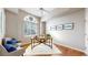 Bright office space with hardwood floors, a large window, and a modern desk setup at 2266 S Kenton St, Aurora, CO 80014