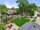 Aerial view of backyard with green lawn, patio, and detached garage at 5115 Osceola St, Denver, CO 80212