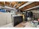Basement laundry area with a modern washer and dryer, offering convenient functionality at 5115 Osceola St, Denver, CO 80212