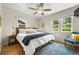 Comfortable bedroom featuring a large bed, ample natural light, and a cozy atmosphere at 5115 Osceola St, Denver, CO 80212