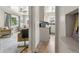 Open-concept living room and kitchen view showcases seamless flow at 5115 Osceola St, Denver, CO 80212