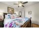 Comfortable main bedroom with a ceiling fan, soft bedding, and cozy decor at 5115 Osceola St, Denver, CO 80212