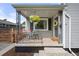 Charming porch adorned with hanging flowers and decorative touches, creating a welcoming entrance at 5115 Osceola St, Denver, CO 80212